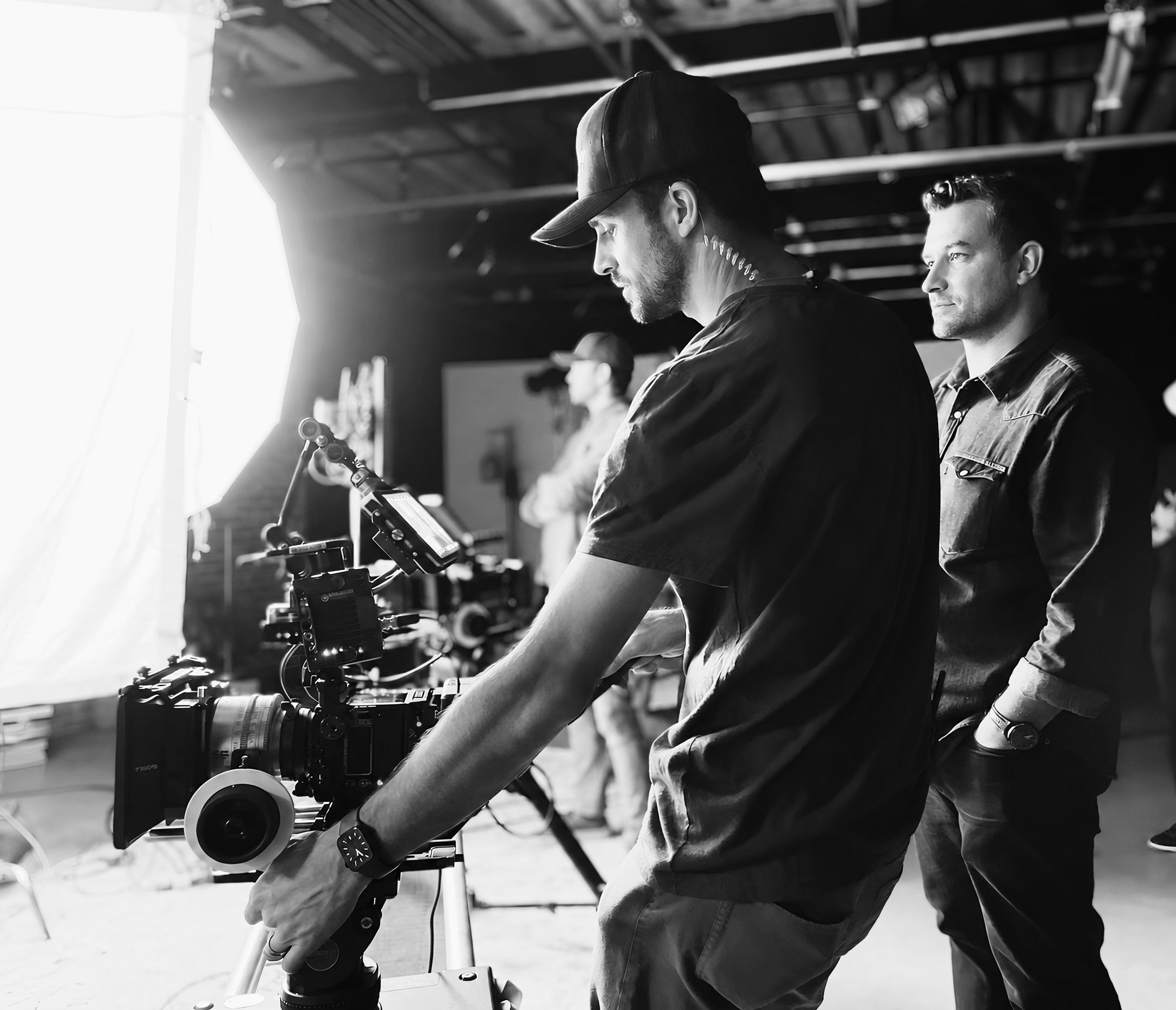 Filmmakers working with a camera on set